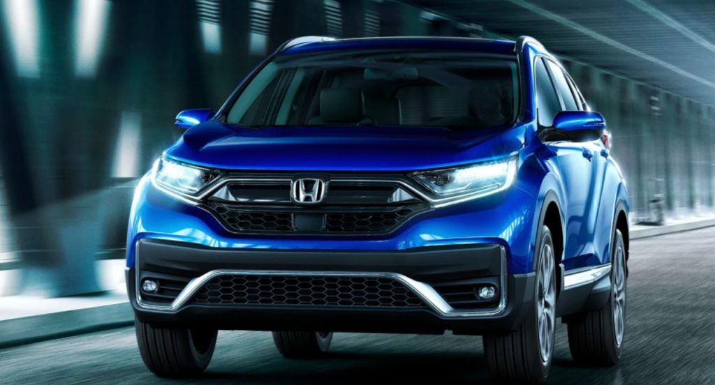 A blue 2022 Honda CR-V is driving. 