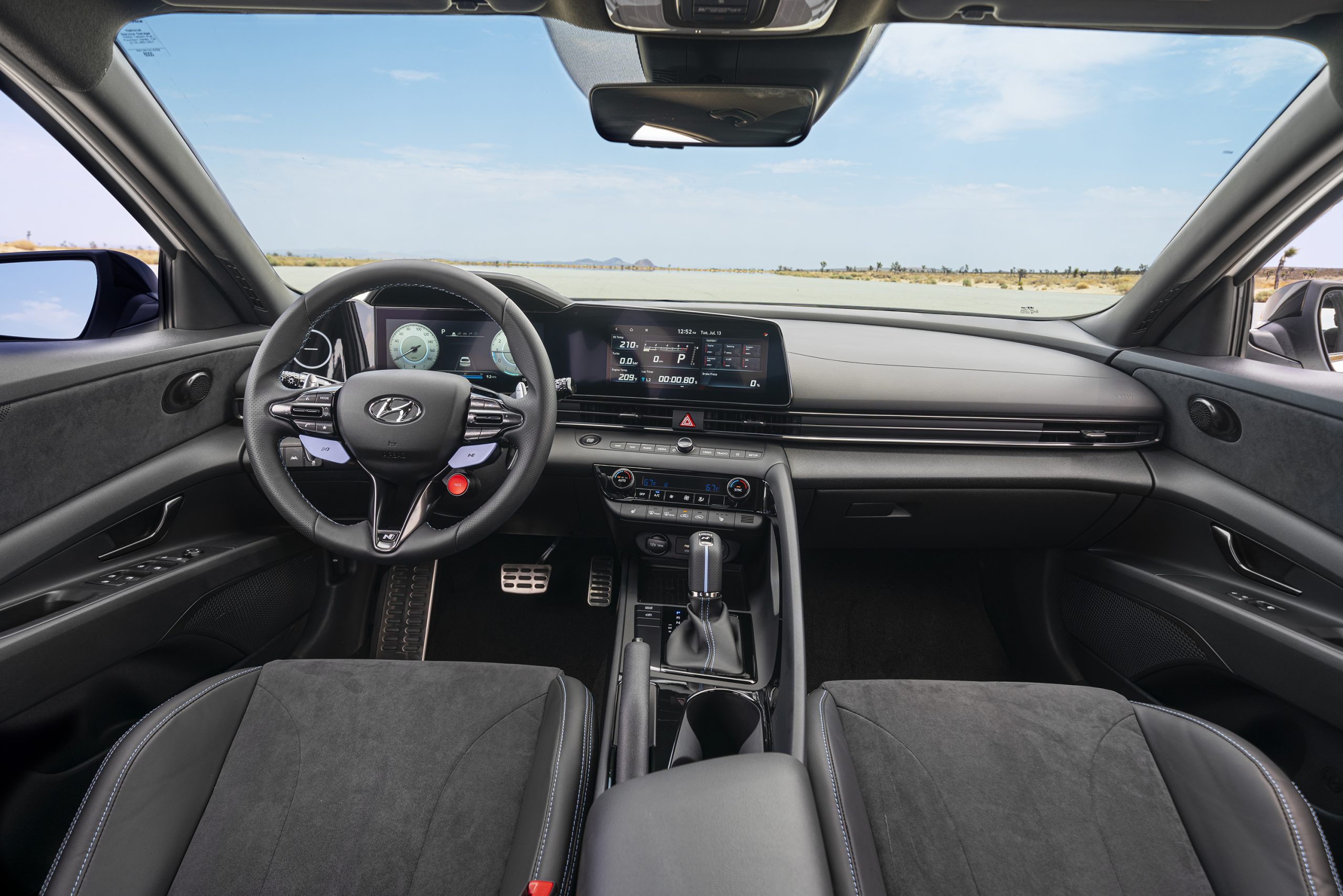 The black and pale blue interior of the 2022 Elantra N with a dual-clutch transmission instead of the standard manual transmission.