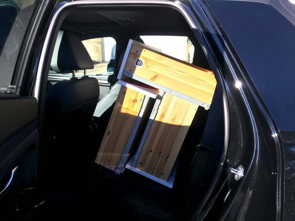 The 2022 Hyundai Santa Cruz with dresser drawers loaded in the rear seat area.