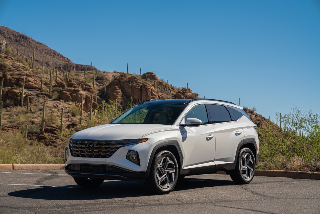 The 2022 Hyundai Tucson Hybrid in a parking lot, it's one of two compact SUVs recommended by Consumer Reports over the Toyota RAV4 Prime