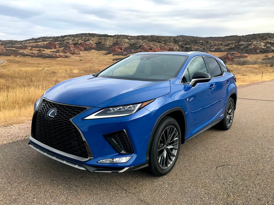 The 2022 Lexus RX 450h F Sport on a gravel road