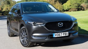 A black 2022 Mazda CX-5 is parked on the road.