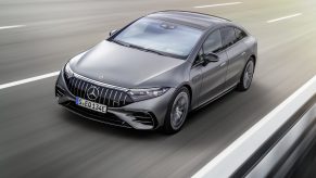 A gray 2022 Mercedes-AMG EQS going around a bend