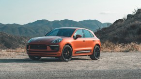 A 2022 Porsche Macan S luxury compact crossover SUV in Papaya Orange