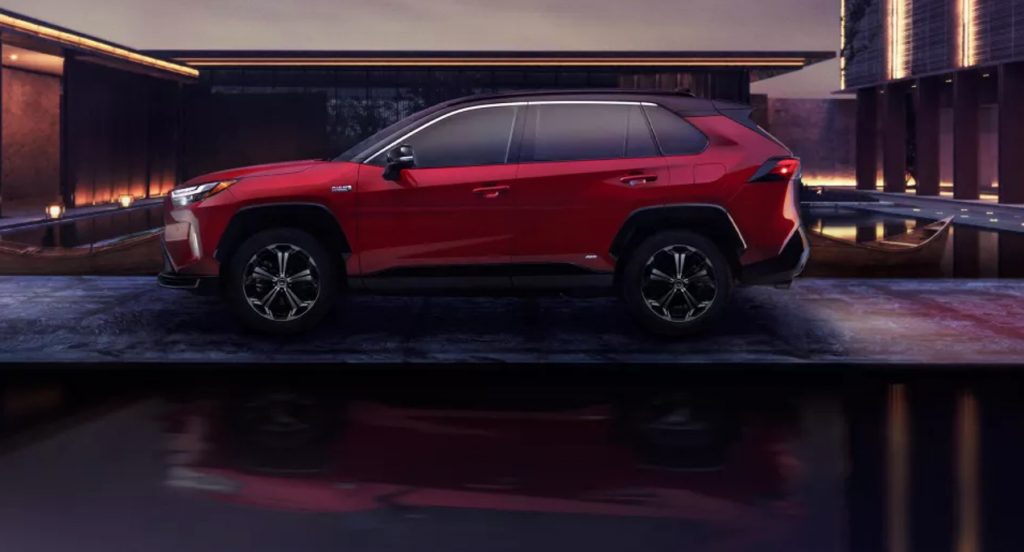 A red 2022 Toyota RAV4 Prime is parked.