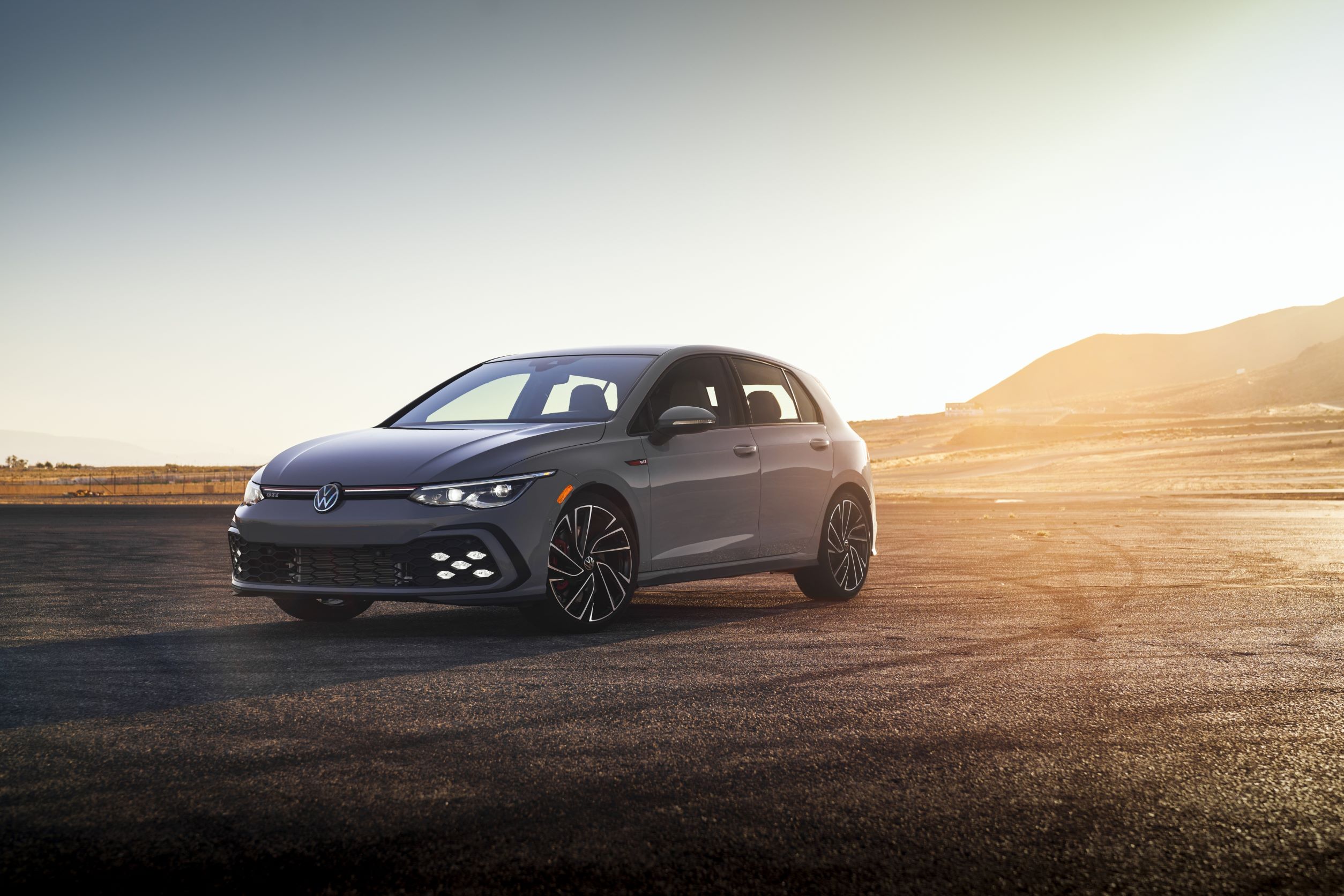 A grey 2022 Volkswagen GTI at sunset