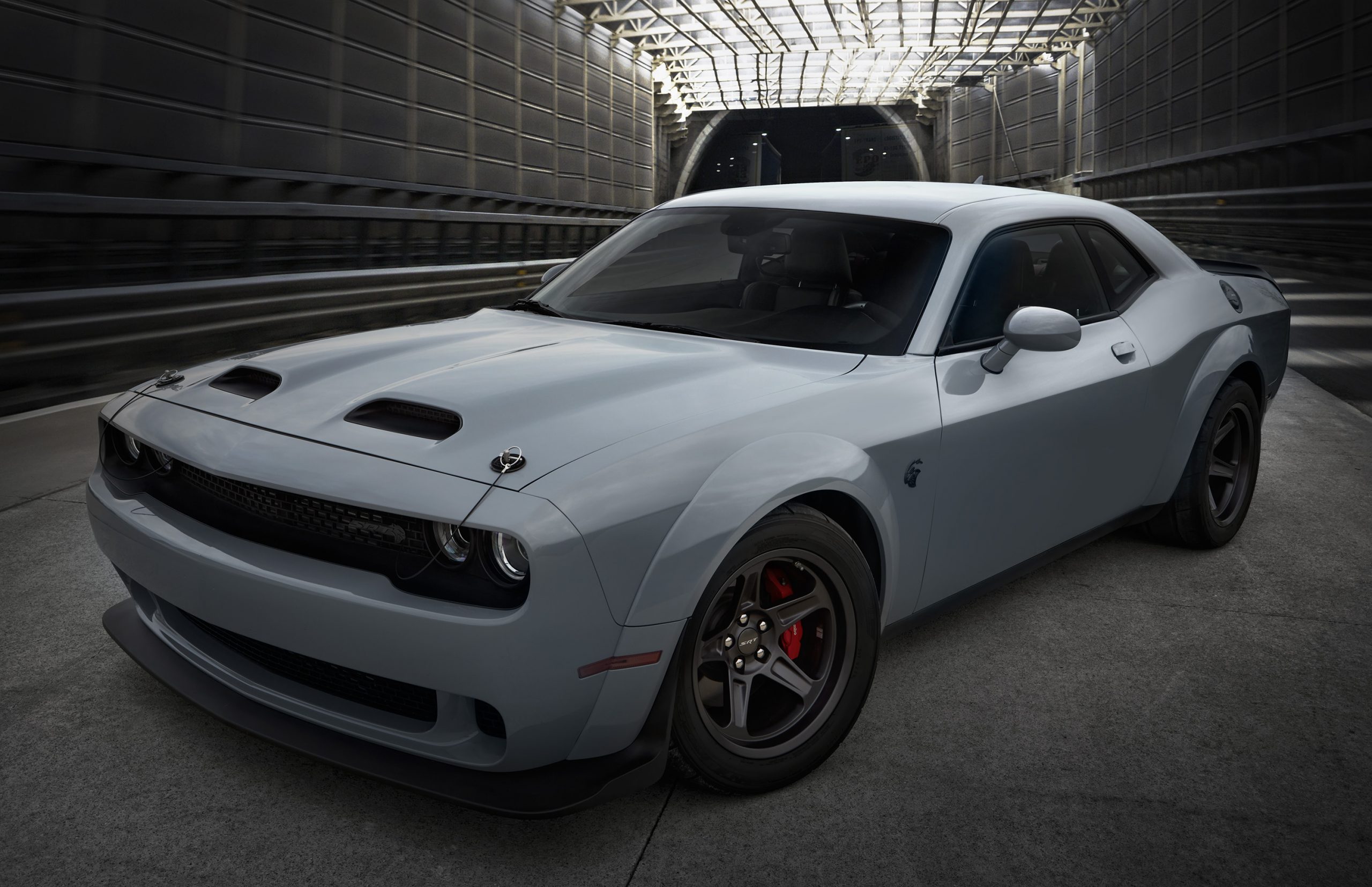 A steel grey Dodge Challenger, shot from the 3/4 angle