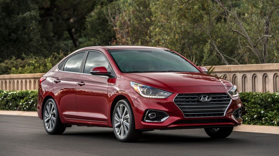 A red 2022 Hyundai Accent subcompact sedan shot from the front 3/4