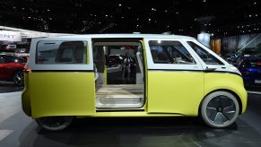 A yellow and white 2024 Volkswagen ID.Buzz electric minivan displayed at the LA Auto Show in 2017