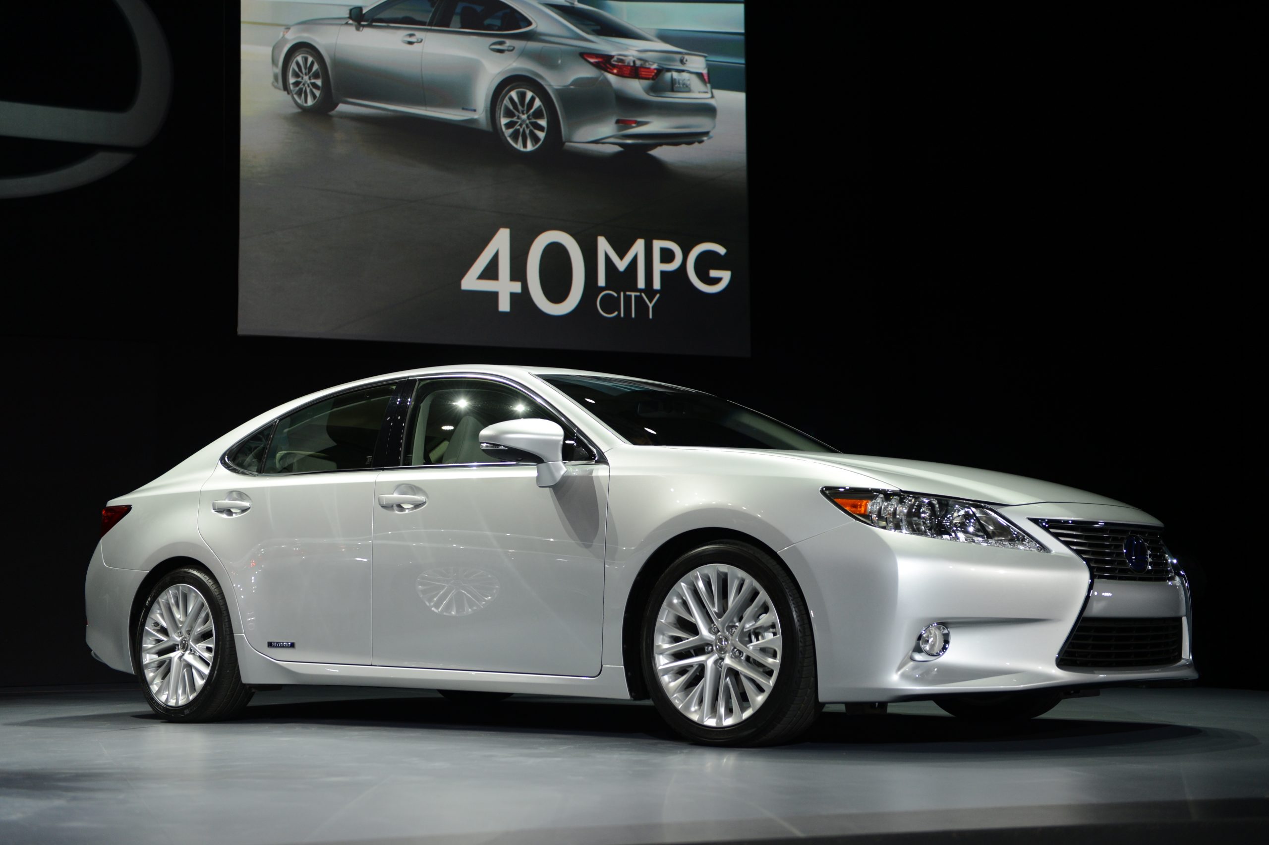 A silver Lexus ES 350 shot from the 3/4 angle at an auto show
