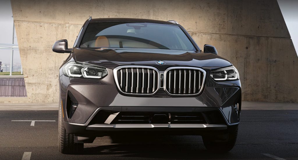 A black 2021 BMW X3 is parked. 