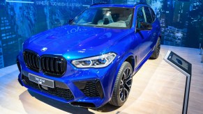 A blue BMW X5 midsize luxury SUV model.