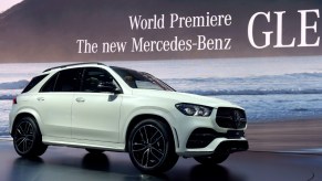 A white BMW X7 is on display.