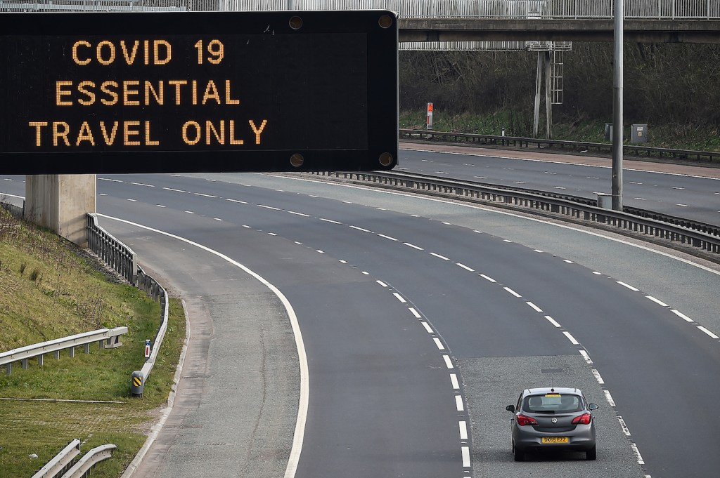 A car on an empty quarantine highways because of travel restrictions | Jeff J Mitchell/Getty Images