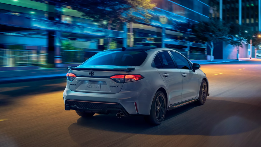 Celestite Gray Metallic 2022 Toyota Corolla driving on a street at night