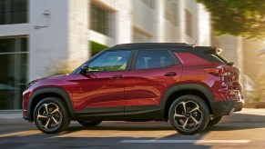 A red 2022 Chevy Trailblazer is driving on the road.