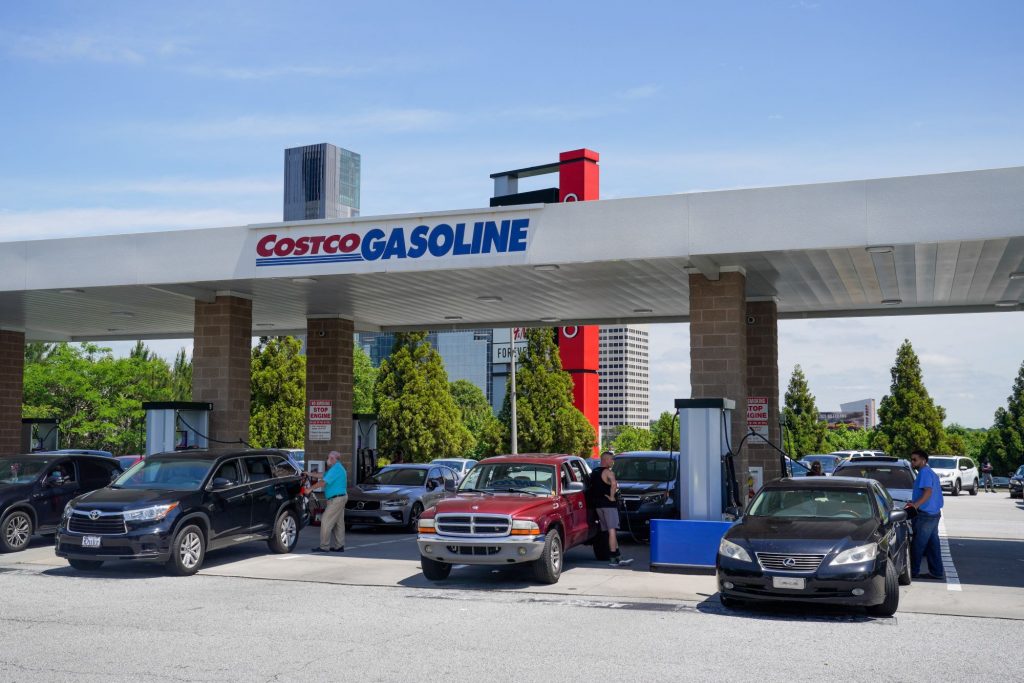 Costco Gas Station with multiple vehicles at the pump.