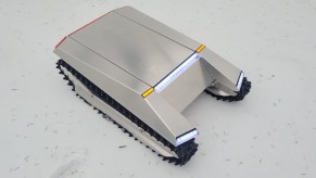 A small silver CyberKAT, which looks like the Cybertruck.