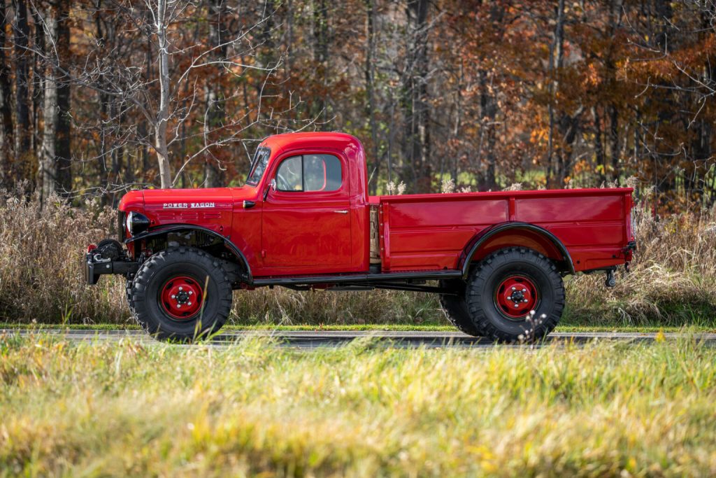 A red and black 1951 Dodge Power Wagon. These were the first mass-production 4x4 pickup trucks in America