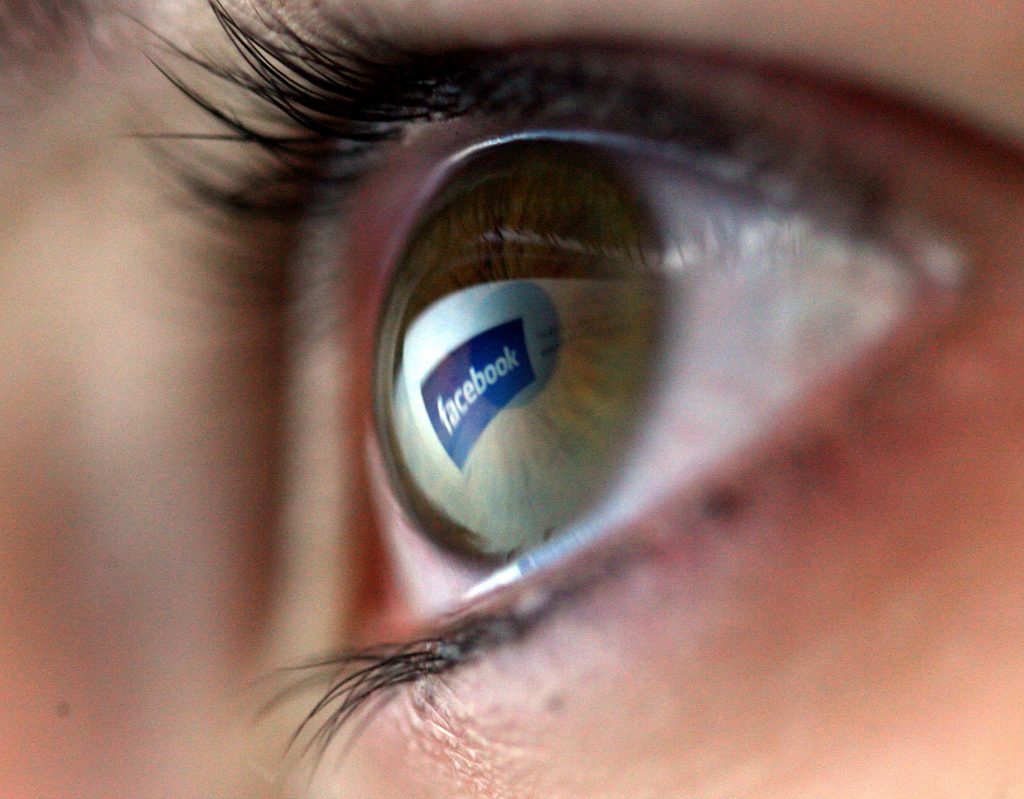 In this photo illustration, the Facebook logo is reflected in the eye of a girl on February 3, 2008, in London, England.