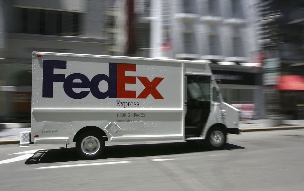 A white FedEx delivery van, which will soon be replaced with BrightDrop EV600 models, the next electric delivery van.