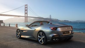 A Ferrari Portofino M grand touring sports car with a silver-gray paint color option parked by the Golden Gate Bridge in San Francisco, California