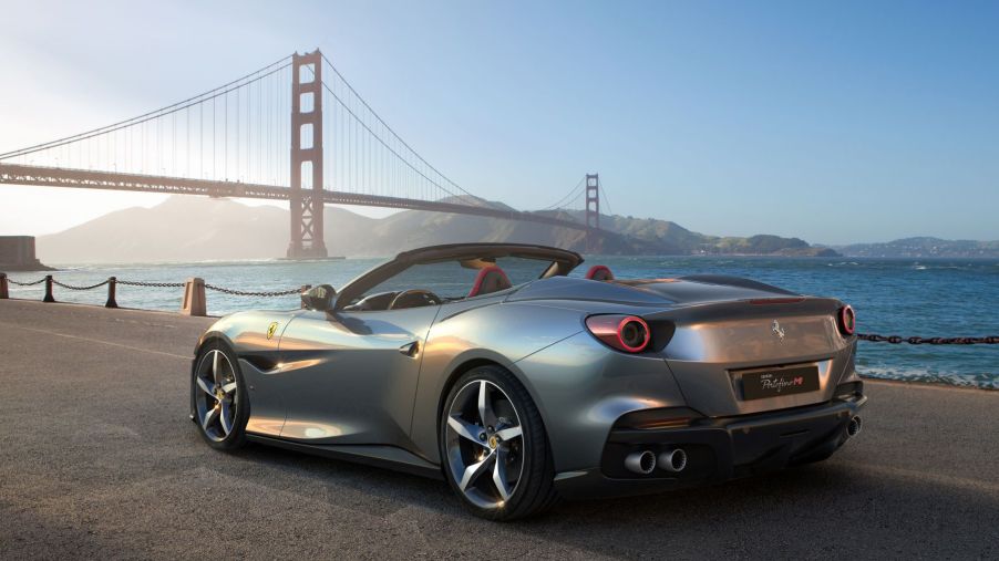 A Ferrari Portofino M grand touring sports car with a silver-gray paint color option parked by the Golden Gate Bridge in San Francisco, California