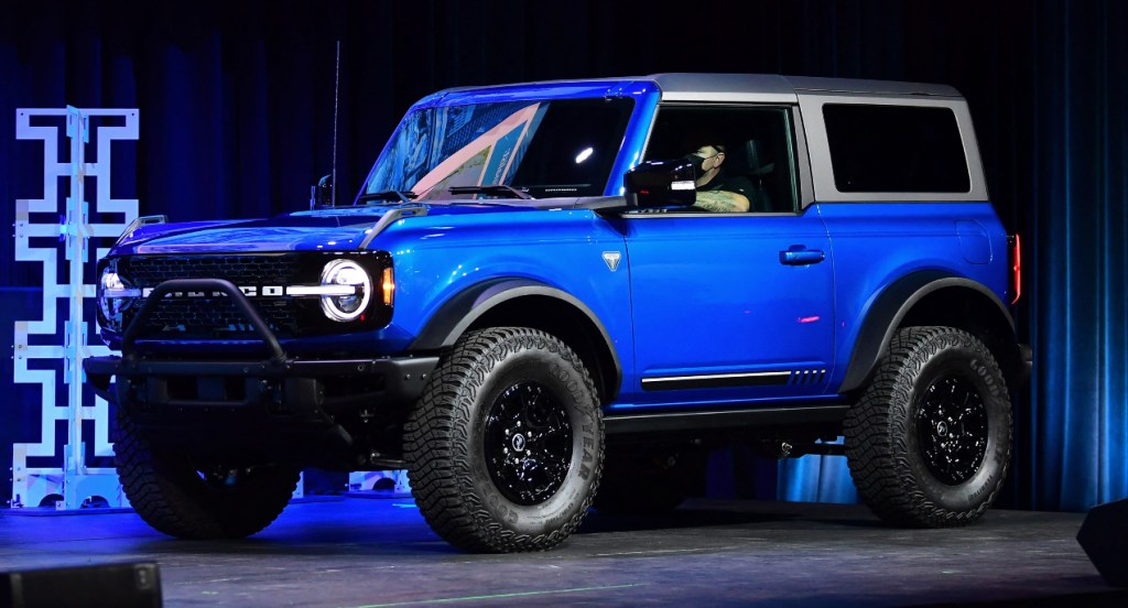 A blue Ford Bronco is on display.