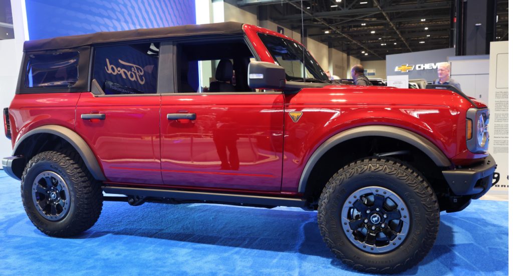 A red 2021 Ford Bronco is on display. 