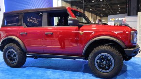 A red 2021 Ford Bronco small SUV is on display.