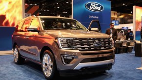 An olive Ford Expedition is on display.