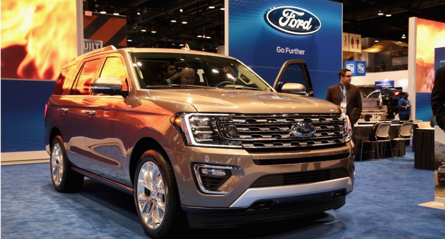 An olive Ford Expedition is on display.