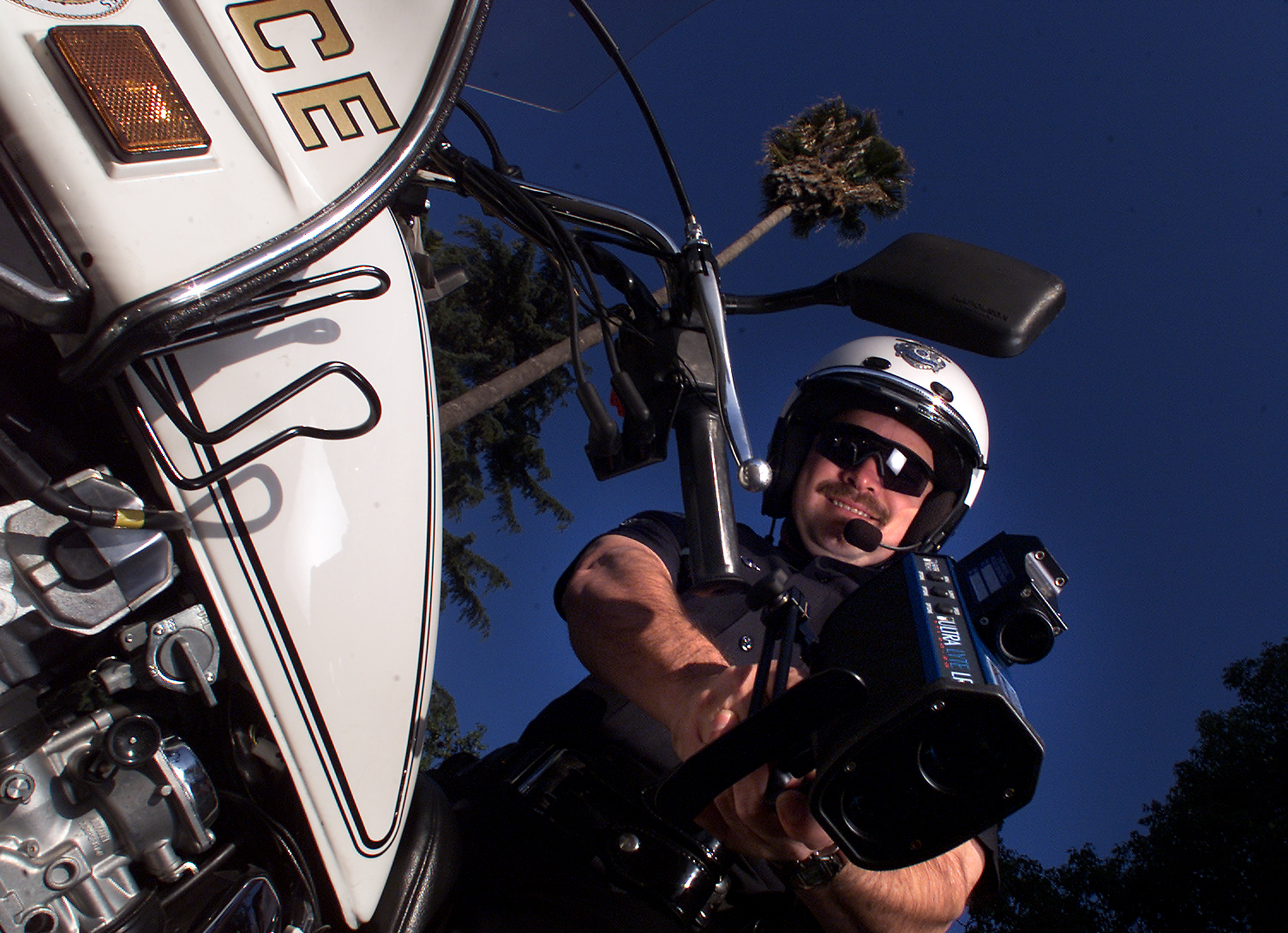 LAPD motor officer Troy Williams with his "Lidar" gun, a laser guided infrared radar, on Sherman Way