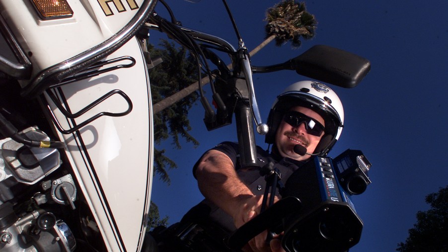 LAPD motor officer Troy Williams with his "Lidar" gun, a laser guided infrared radar, on Sherman Way