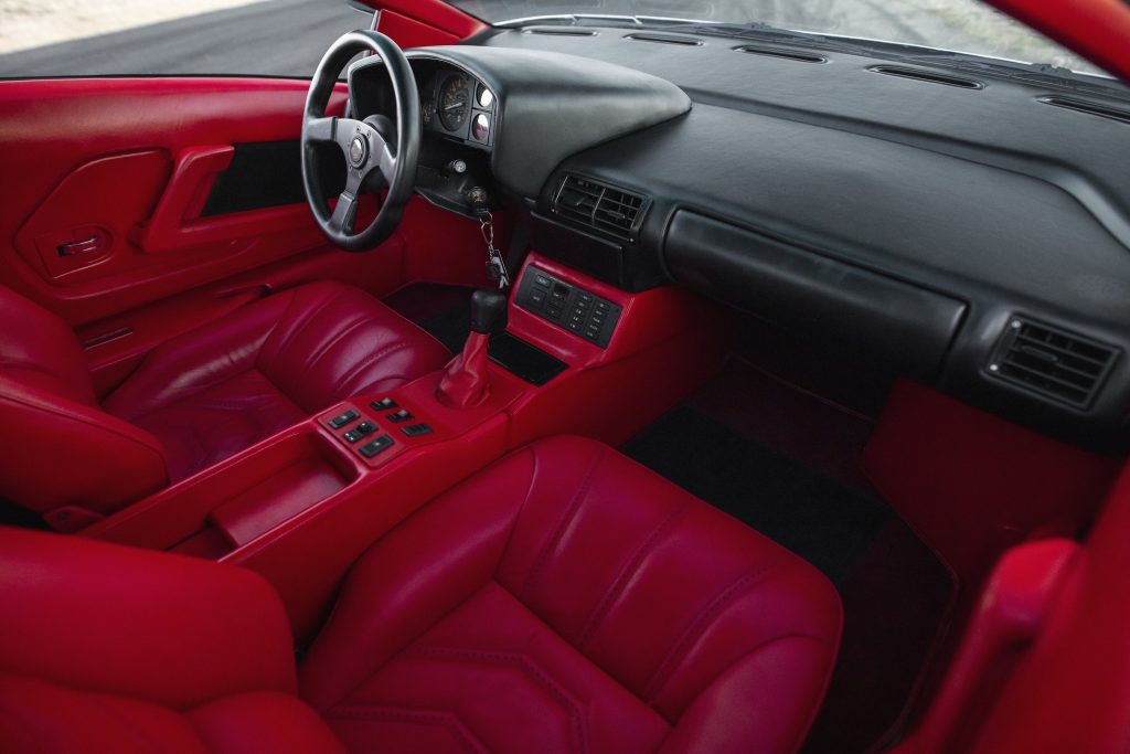 The red-leather-upholstered seats and black-leather-upholstered dashboard of Giorgio Moroder's 1988 Cizeta V16T prototype