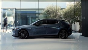 Gray 2022 Mazda3 Hatchback parked in a white room