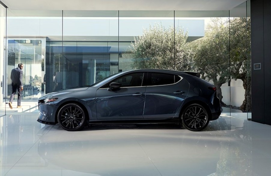 Gray 2022 Mazda3 Hatchback parked in a white room