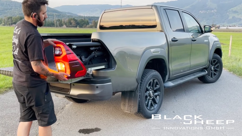 Black Sheep Innovations shows off its gun storage secret compartment inside the taillight of a Toyota Hilux pickup truck.