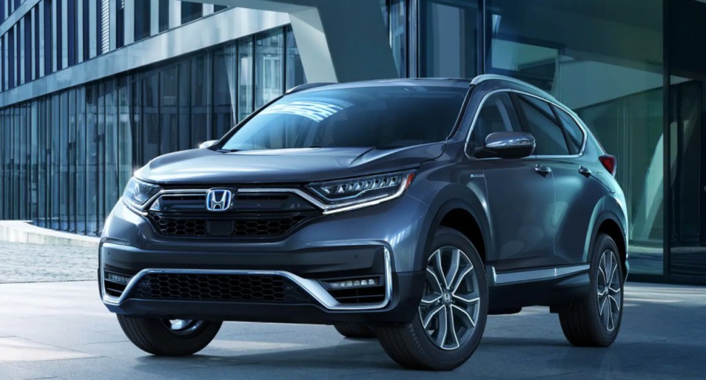 A gray 2022 Honda CR-V is parked outside a building.