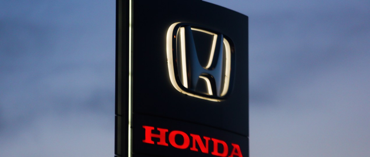 A black Honda logo is seen near the car showroom in Krakow, Poland.