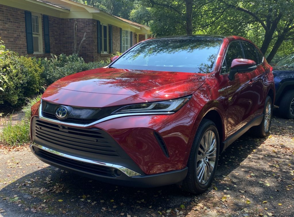 The 2021 Toyota Venza midsize SUV parked near a home, it's one of Consumer Reports most reliable midsize SUVs.