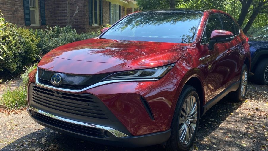The 2021 Toyota Venza parked near a home.