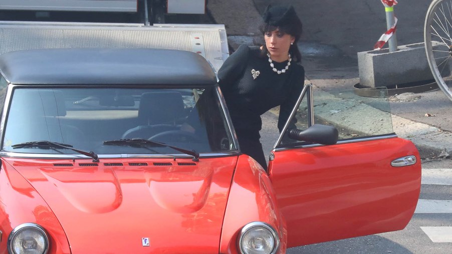 Lady Gaga getting into a Fiat Spider 124 during House of Gucci | Robino Salvatore/GC Images