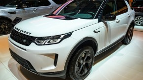 A white Land Rover Discovery parked inside, one was recently flipped after rear-ending a Toyota GR Yaris.