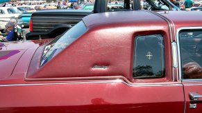 A red Lincoln Continental with a landau roof