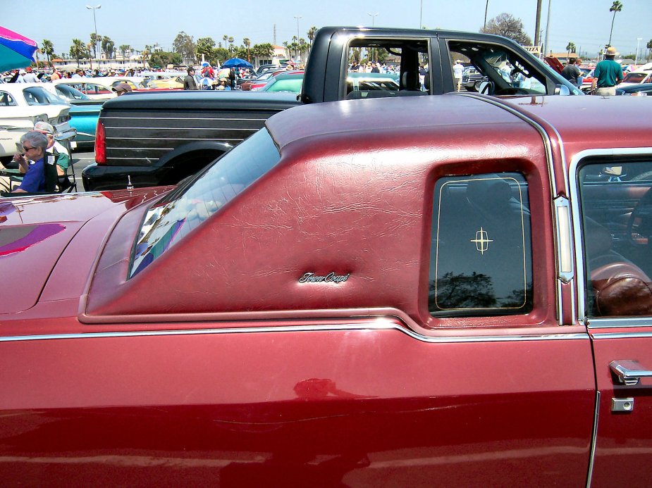 A red Lincoln Continental with a landau roof