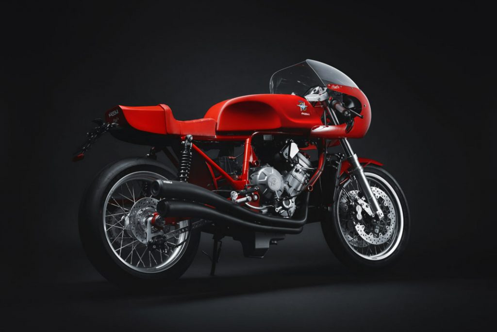 The rear 3/4 view of a red Magni Italia 01/01 on its side-stand