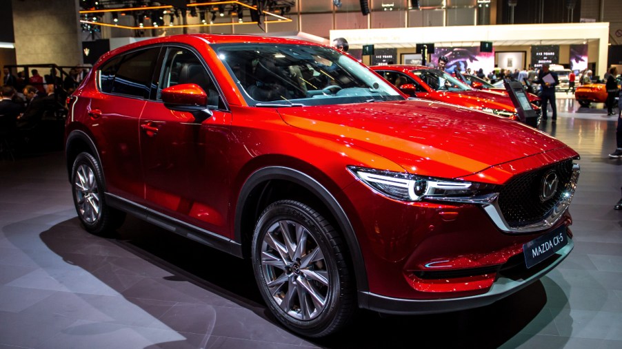 A red 2021 Mazda CX-5 compact SUV model is on display.