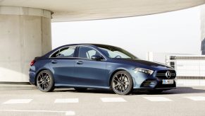 A blue Mercedes-Benz AMG A35 sedan shot from the front 3/4