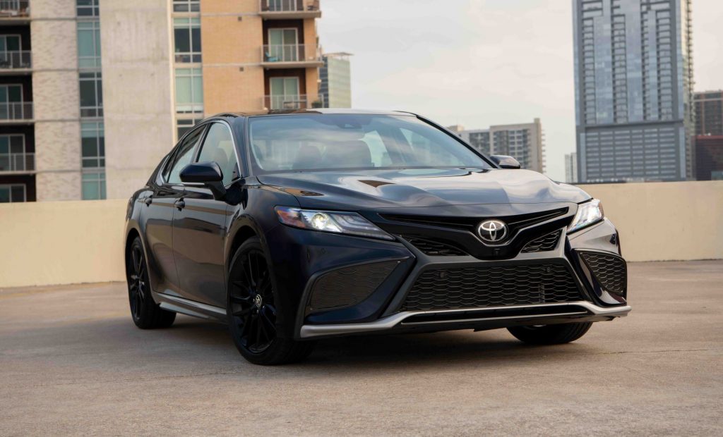 Midnight Black Metallic 2022 Toyota Camry parked on the roof of a building